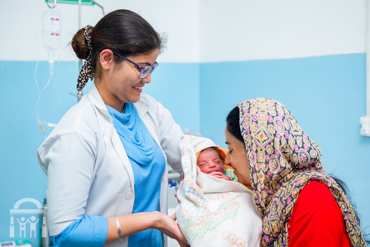 OBGYN with new mother and newborn at Guru Nanak Mission Hospital Dhahan Kaleran near Banga